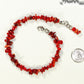 Natural Red Coral Chip Bracelet beside a dime.