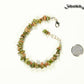 Natural Unakite Crystal Chip Bracelet beside a dime.