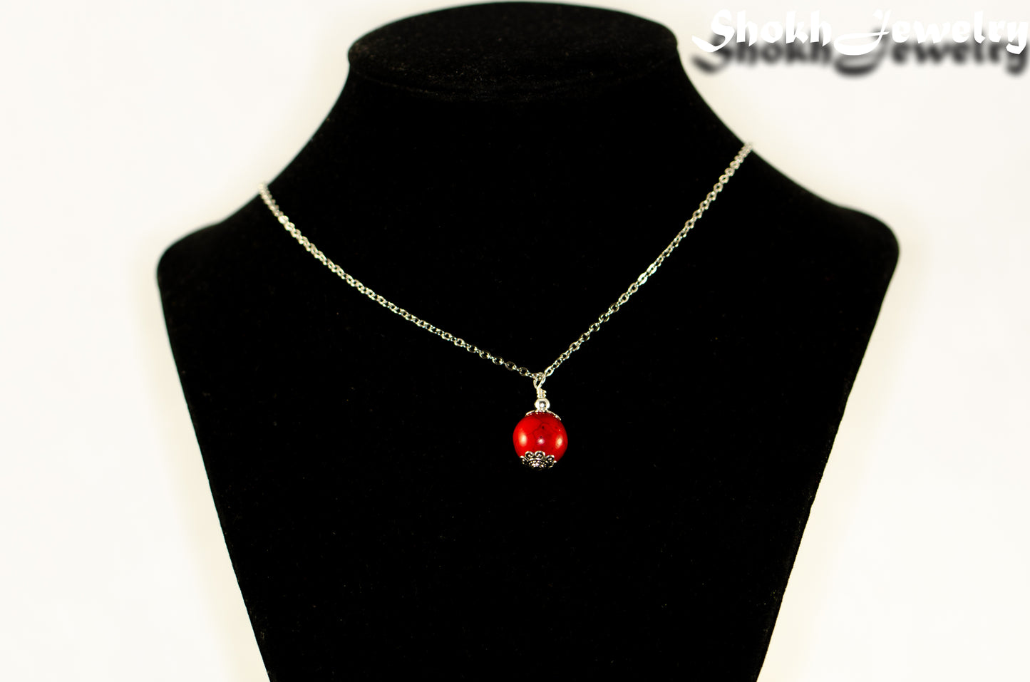 12mm Red Howlite Pendant Necklace displayed on a bust.