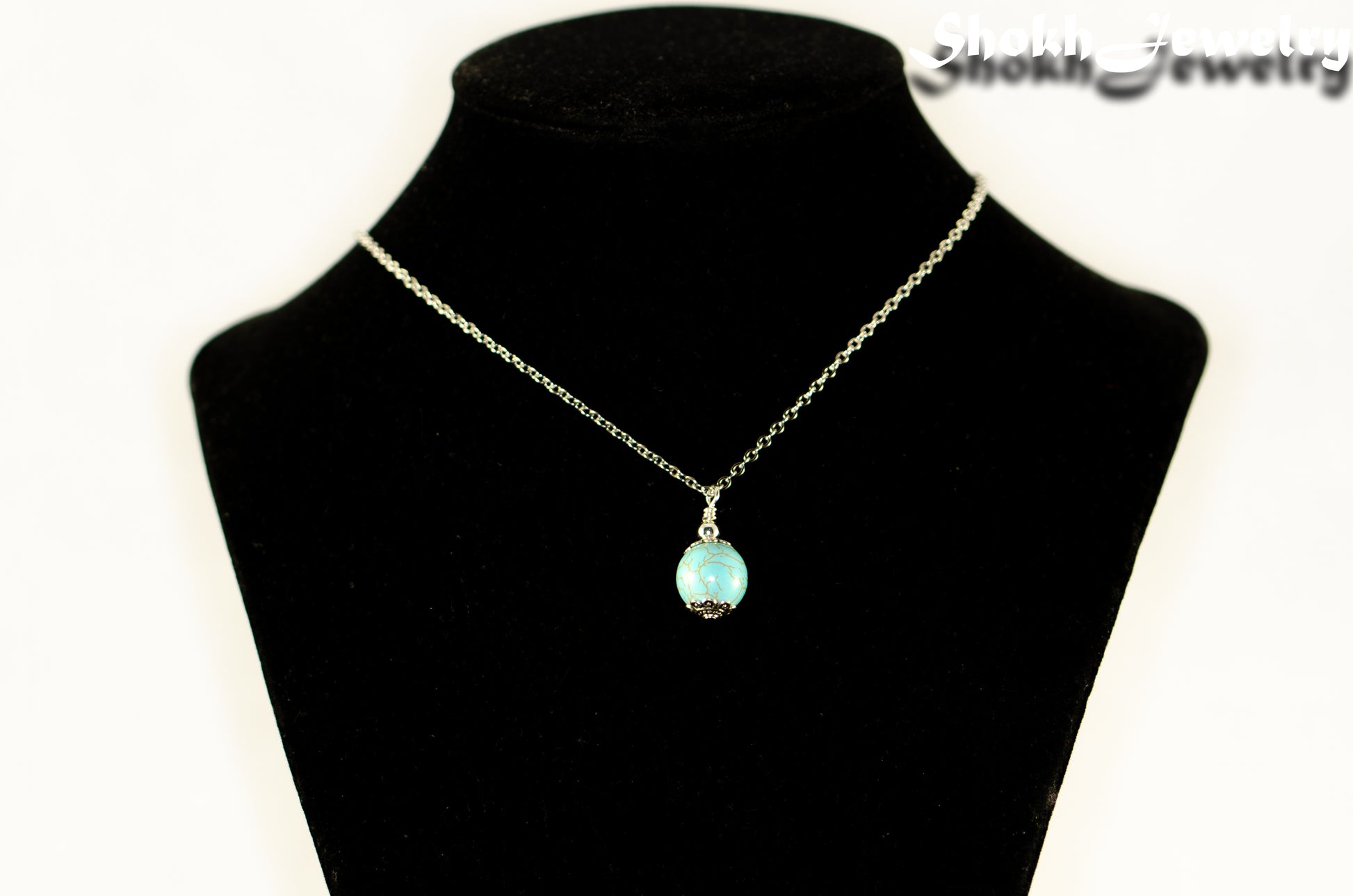 12mm Turquoise Howlite Pendant Necklace displayed on a bust.