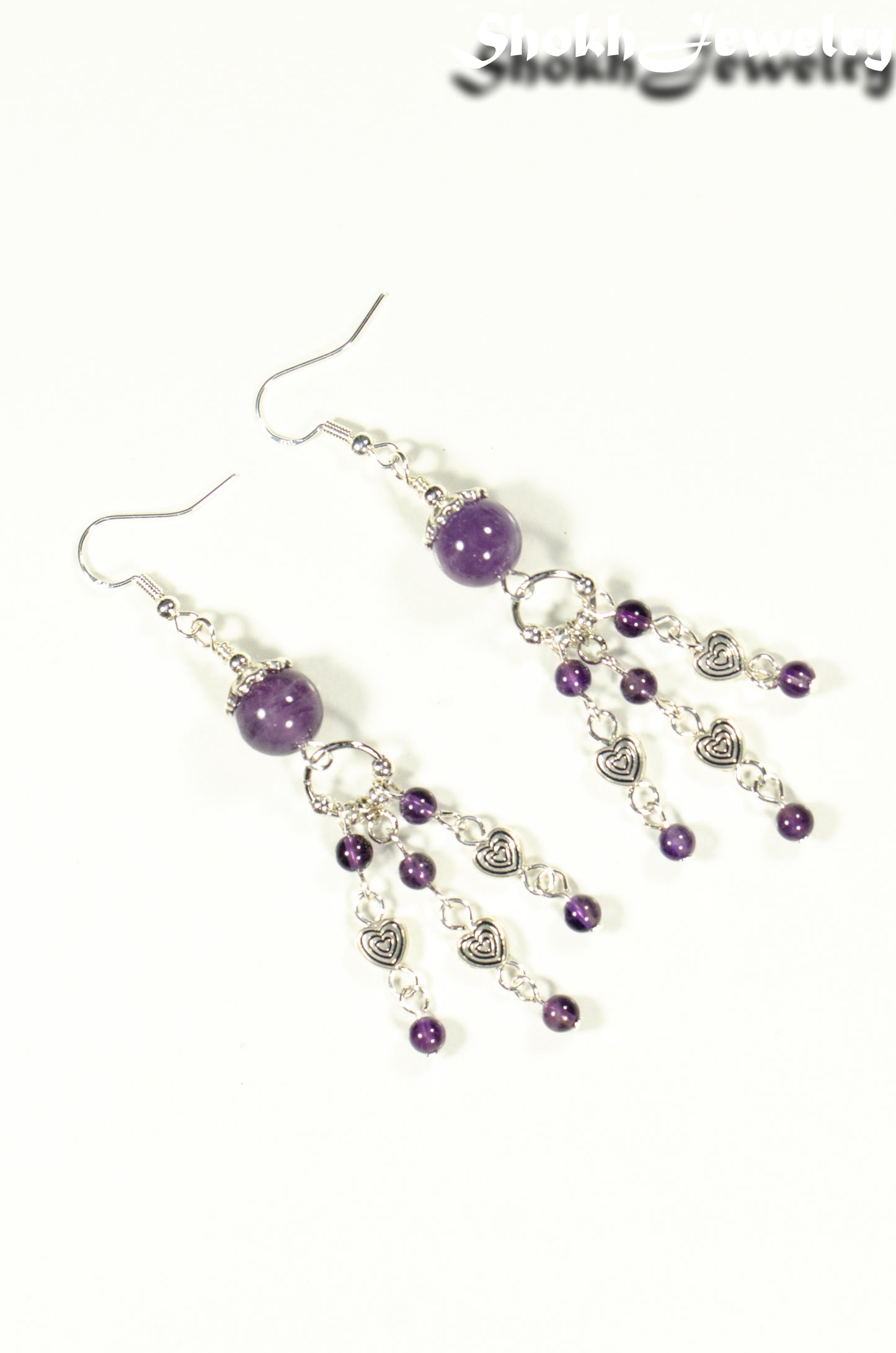 Top view of Statement Amethyst and Heart Chandelier Earrings.