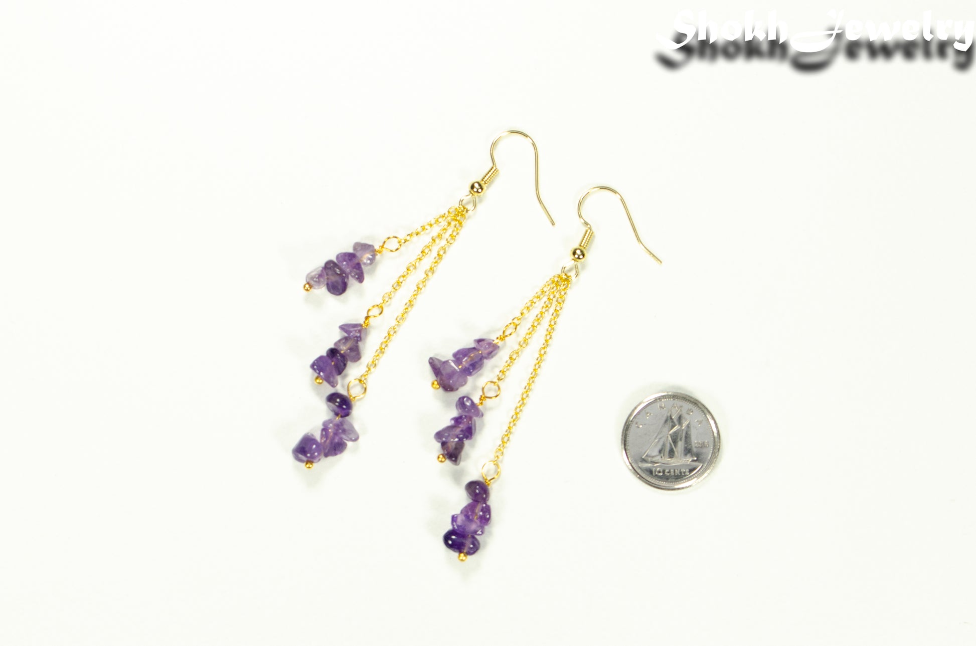 Long Gold Plated Chain and Amethyst Crystal Chip Earrings beside a dime.