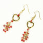 Top view of Gold Plated Heart and Red Crystal Cluster Earrings.