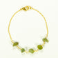 Top view of Peridot Crystal Chip and Gold Plated Chain Bracelet.