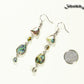 Long Abalone Shell and Glass Crystal Earrings beside a dime.