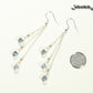 Long Silver Plated Chain and Czech Teardrop Crystal Earrings beside a dime.