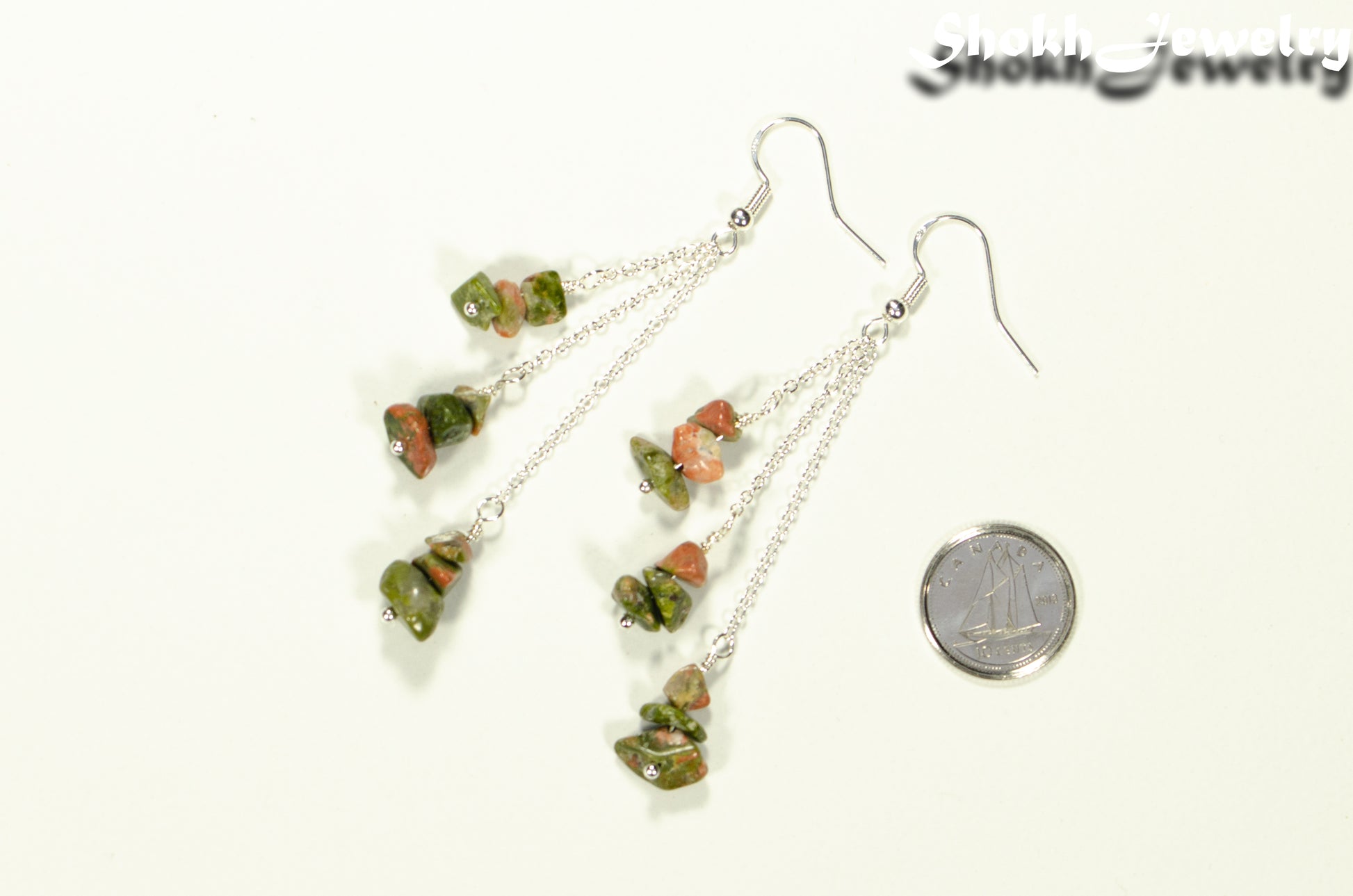 Long Silver Plated Chain and Unakite Crystal Chip Earrings beside a dime.