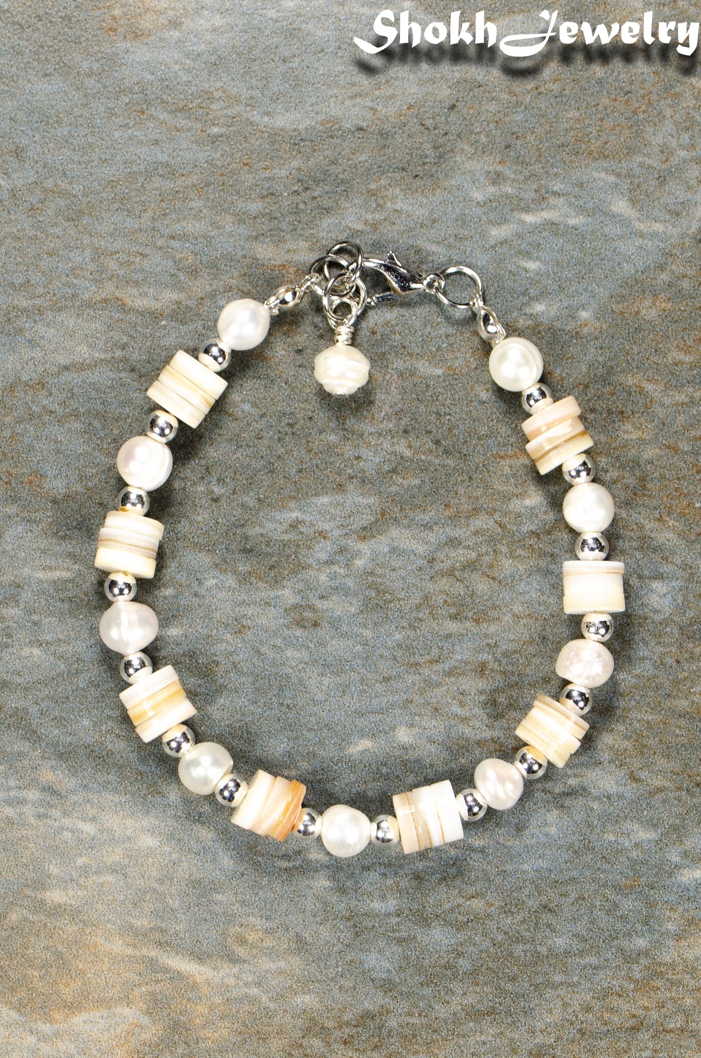 Top view of Freshwater Pearl and Seashell Bracelet with Clasp.