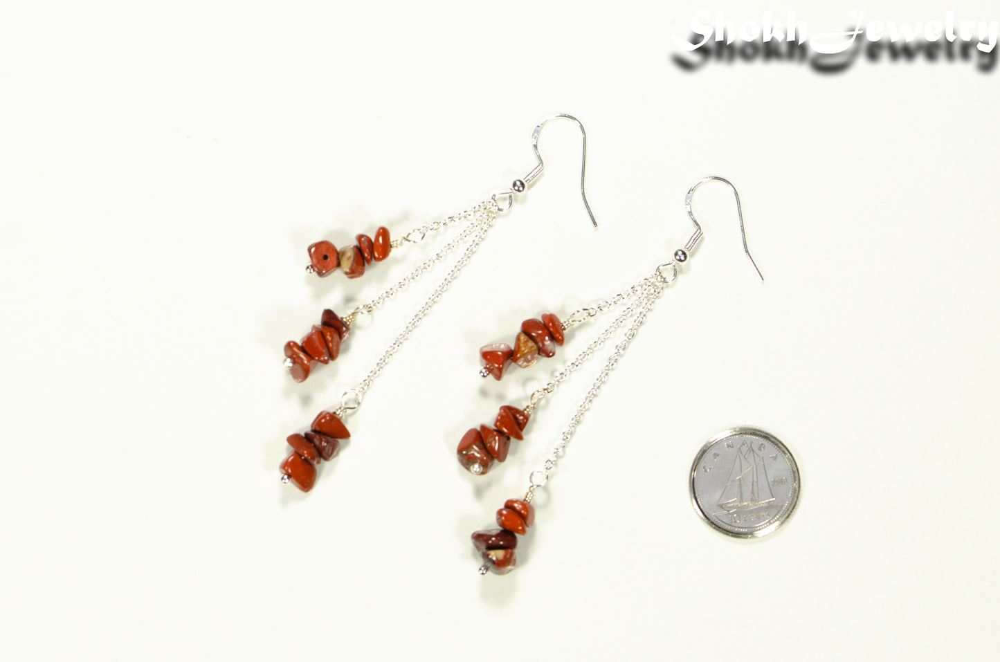 Long Silver Plated Chain and Red Jasper Chip Earrings beside a dime.