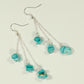 Top view of Long Silver Plated Chain and Turquoise Crystal Chip Earrings.