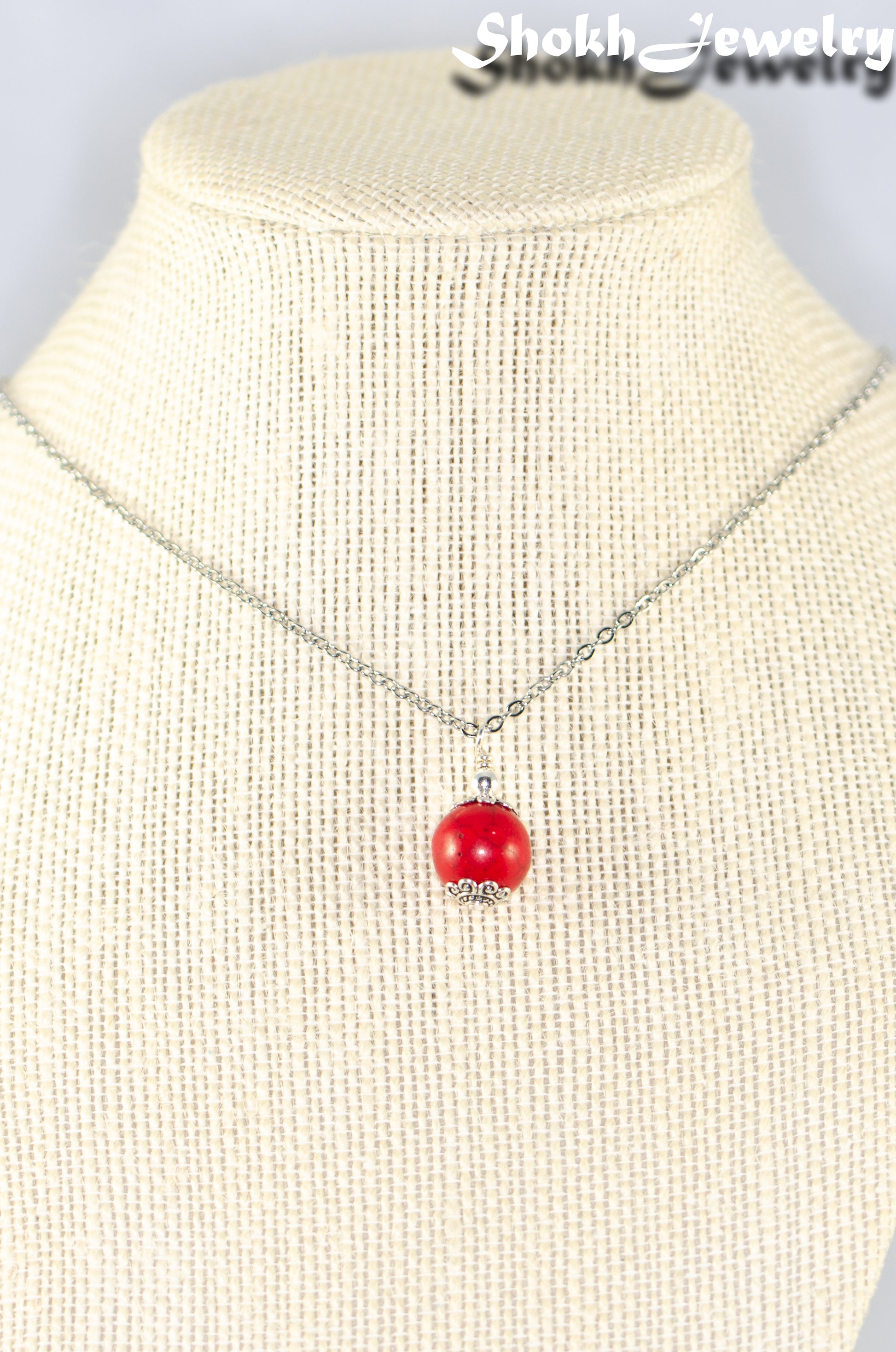 12mm Red Howlite Pendant Necklace displayed on a bust.