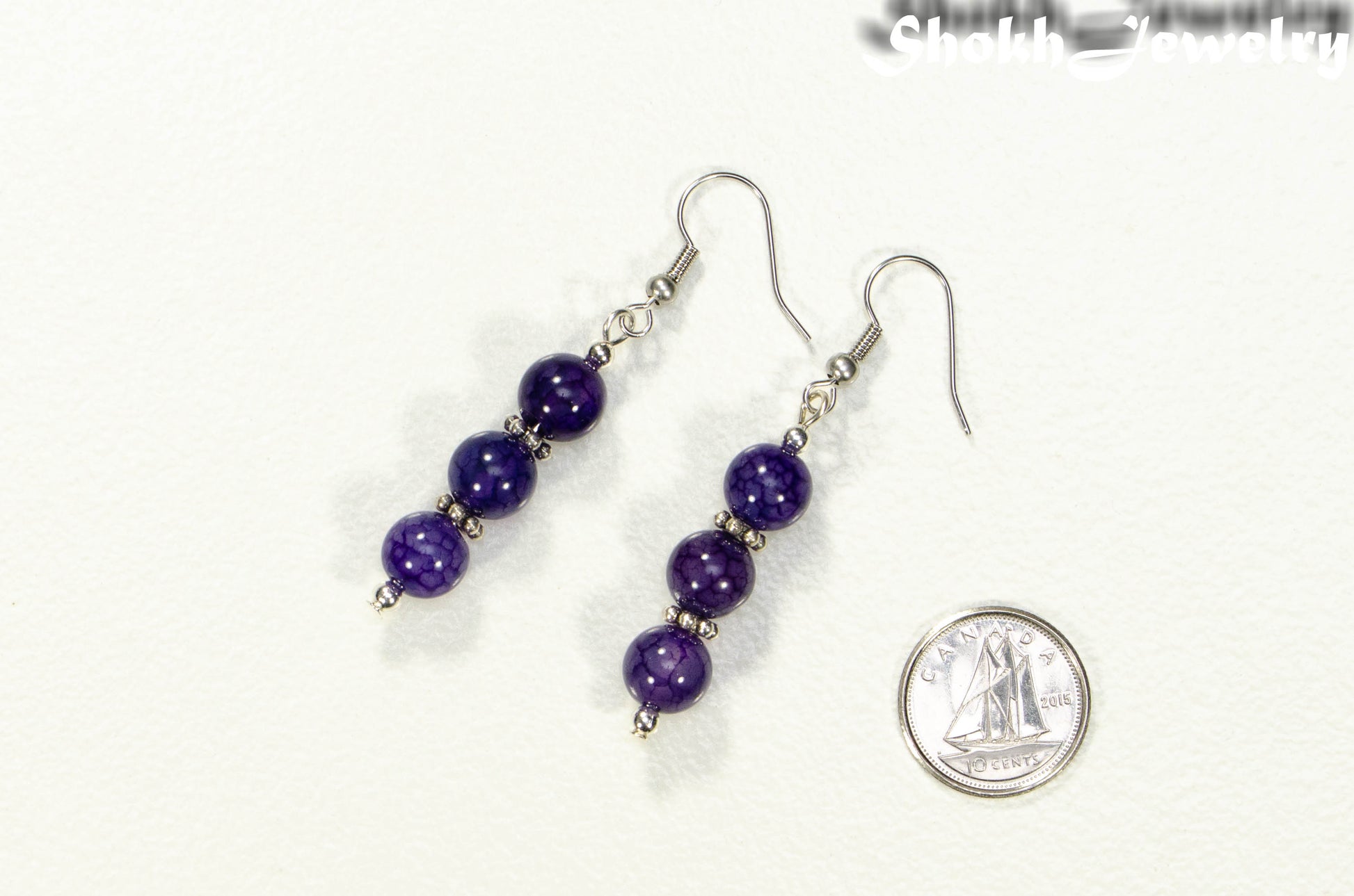 Natural Purple Agate Beaded Bar Earrings beside a dime.