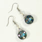 Top view of Iridescent Blue Glass Crystal Beads Earrings.