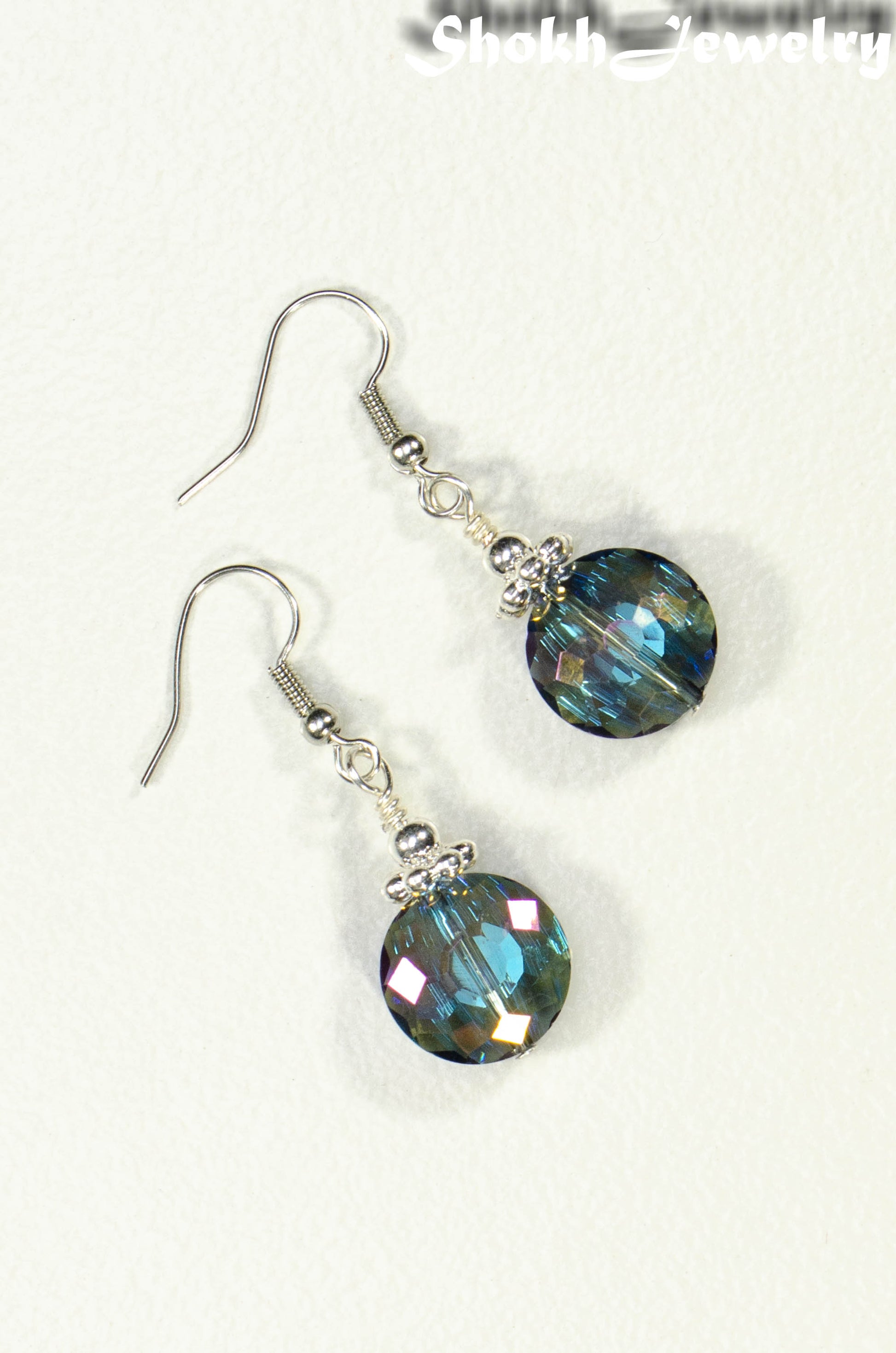 Top view of Iridescent Blue Glass Crystal Beads Earrings.