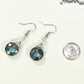 Iridescent Blue Glass Crystal Beads Earrings beside a dime.