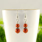 Close up of Small Natural Red Jasper Earrings.