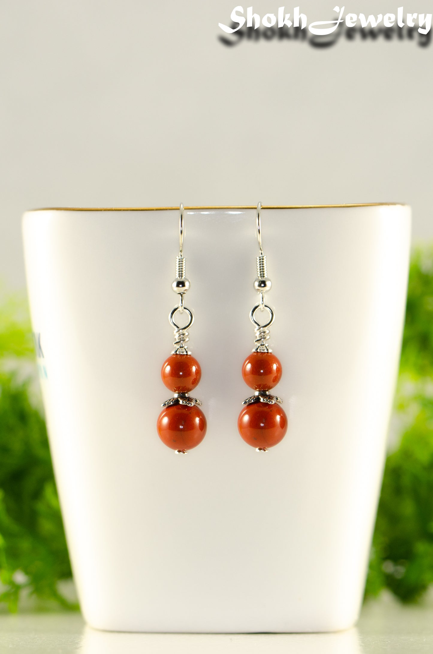 Close up of Small Natural Red Jasper Earrings.