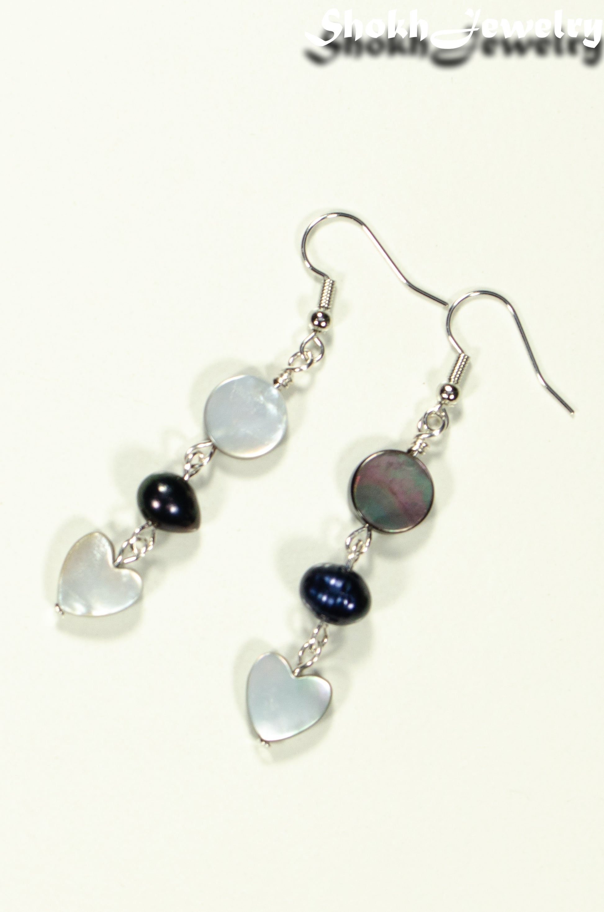 Top view of Grey Seashell and Black Pearl Earrings.
