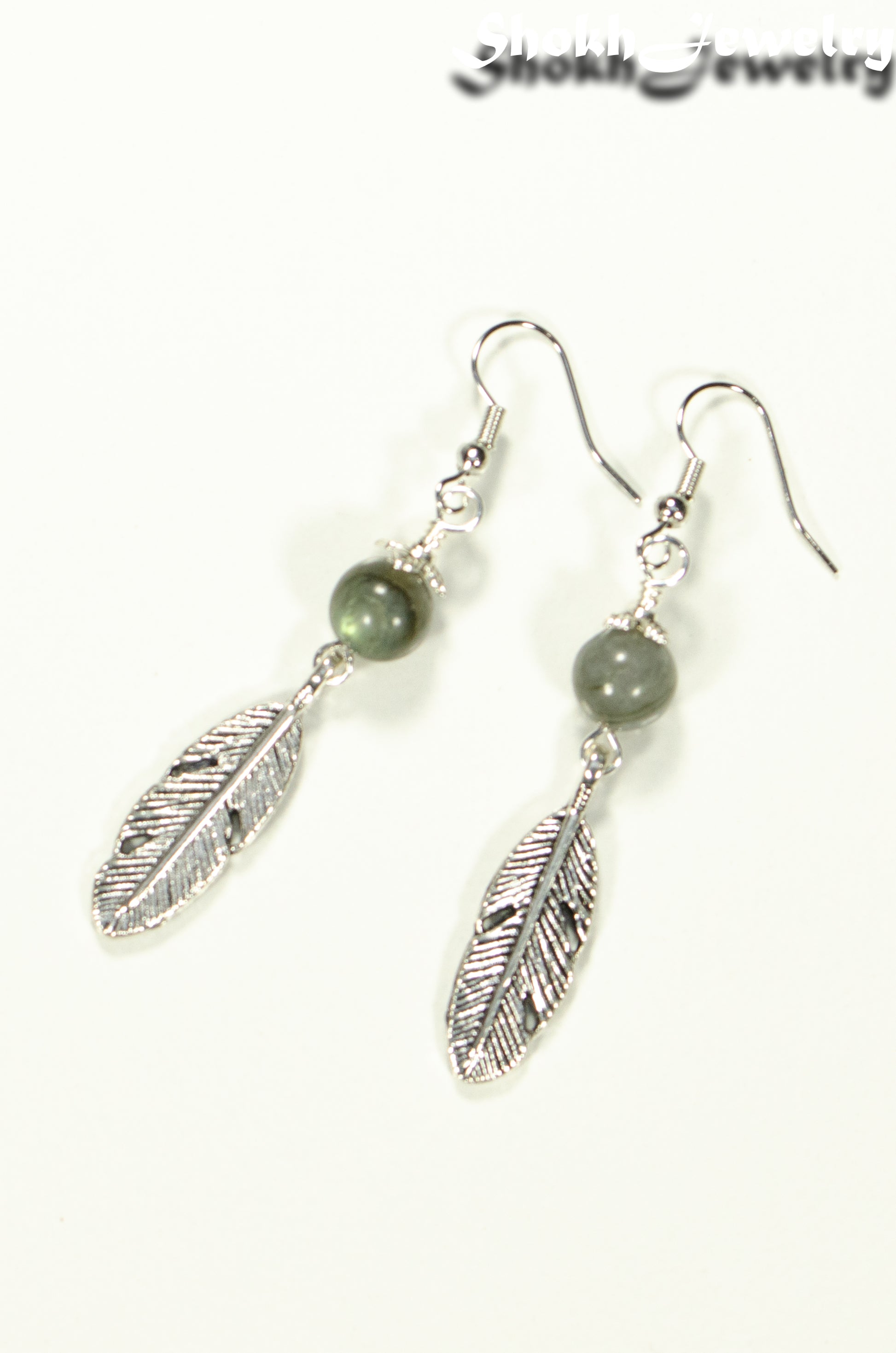 Top view of Labradorite Crystal and Tibetan Silver Feather Earrings.