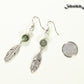 Labradorite Crystal and Tibetan Silver Feather Earrings beside a dime.