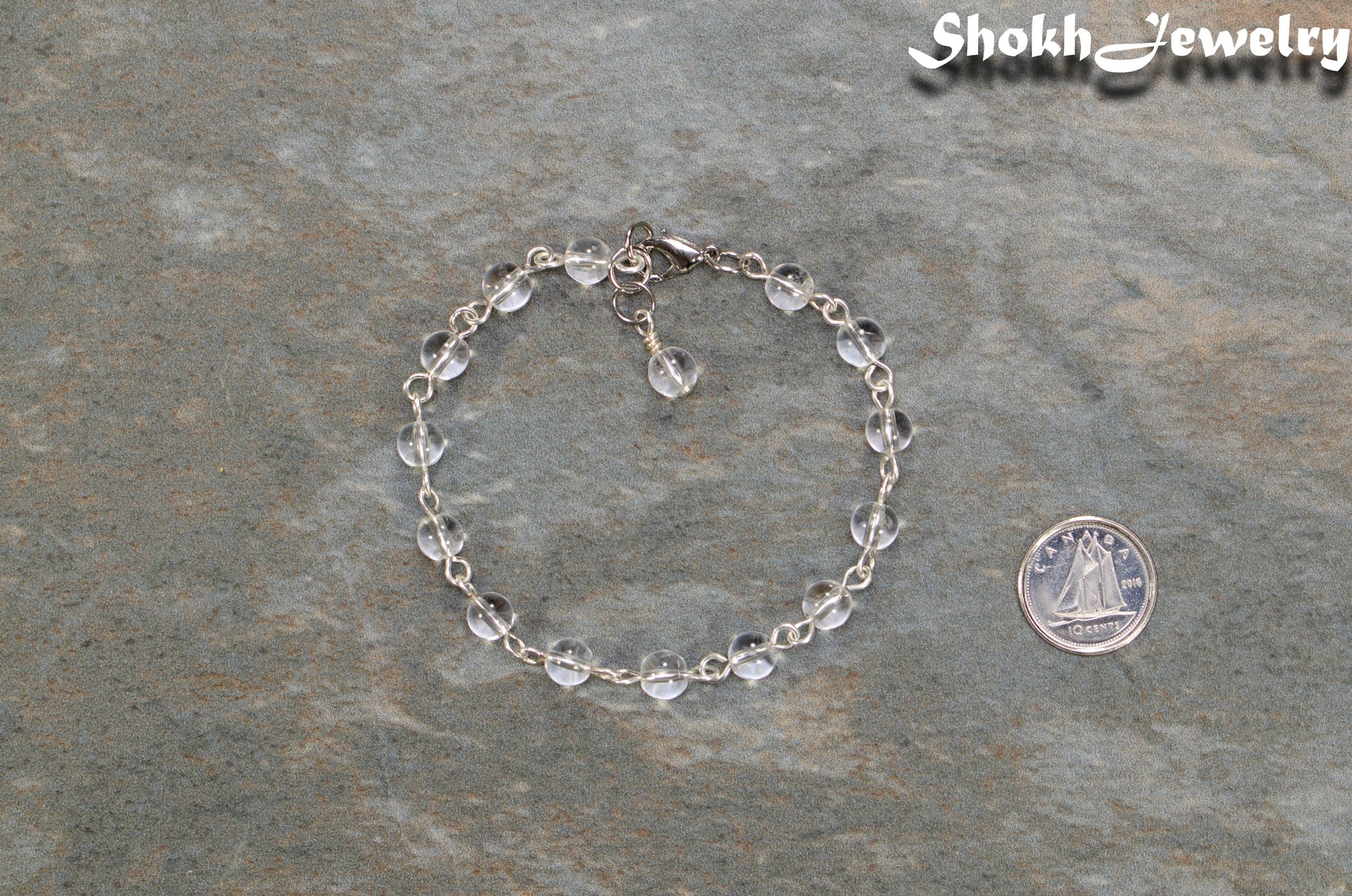 Handmade Clear Quartz Link Chain Anklet for Women beside a dime.