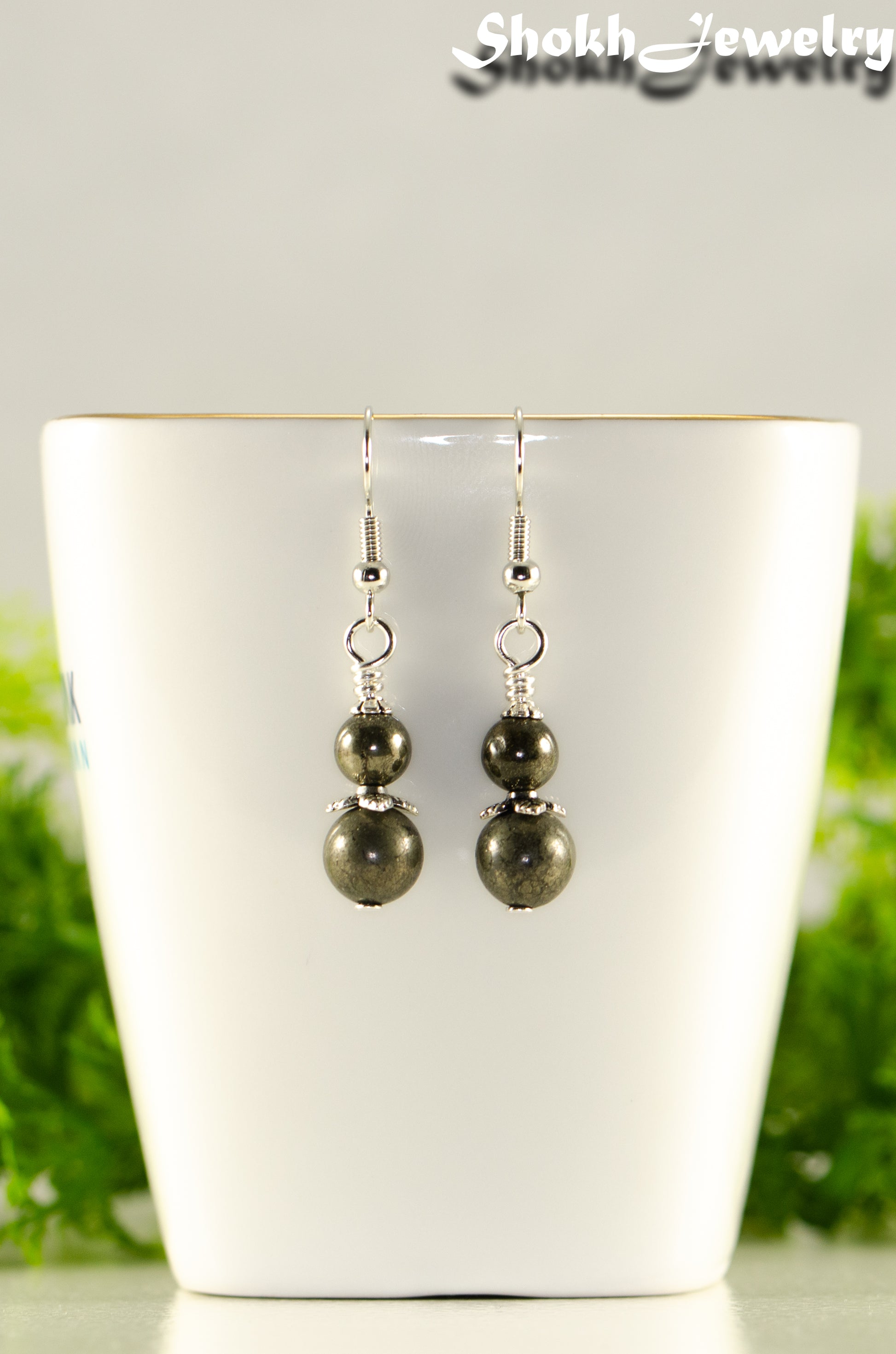 Close up of Small Natural Pyrite Earrings.