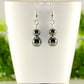 Small Natural Hematite Earrings displayed on a tea cup.