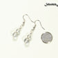 Small Clear Quartz Earrings beside a dime.