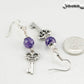 Purple Agate and Key Charm Dangle Earrings beside a dime.