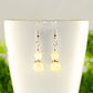 Close up of Small Natural Citrine Crystal Earrings.