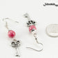 Red Quartzite and Key Charm Dangle Earrings beside a dime.