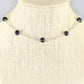 Close up of Black Freshwater Pearl and Dainty Chain Choker Necklace.