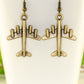 Close up of Antique Bronze 3D Plane Charm Earrings.