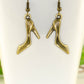 Close up of Antique Bronze High Heel Shoe Charm Earrings.