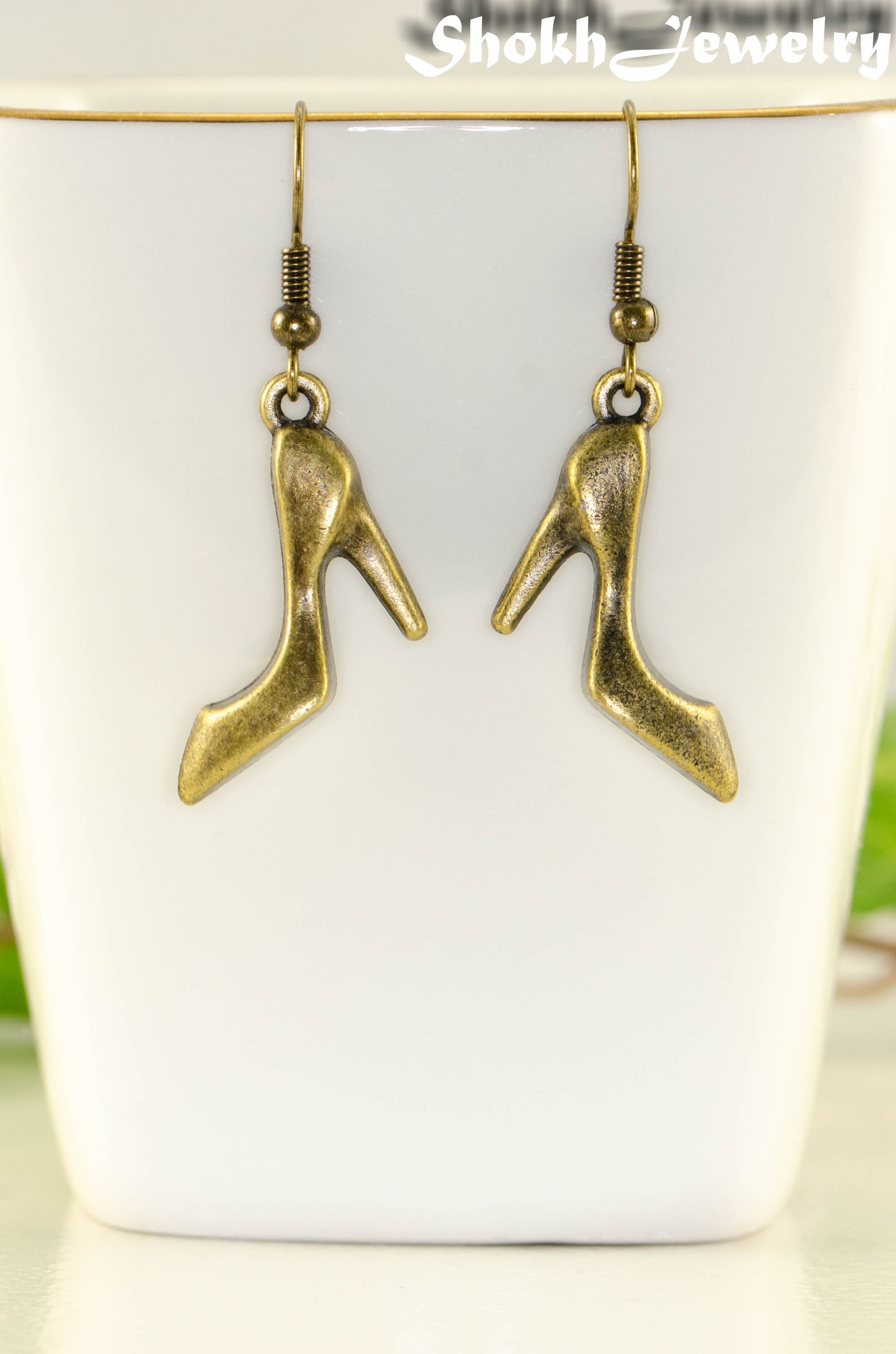 Close up of Antique Bronze High Heel Shoe Charm Earrings.