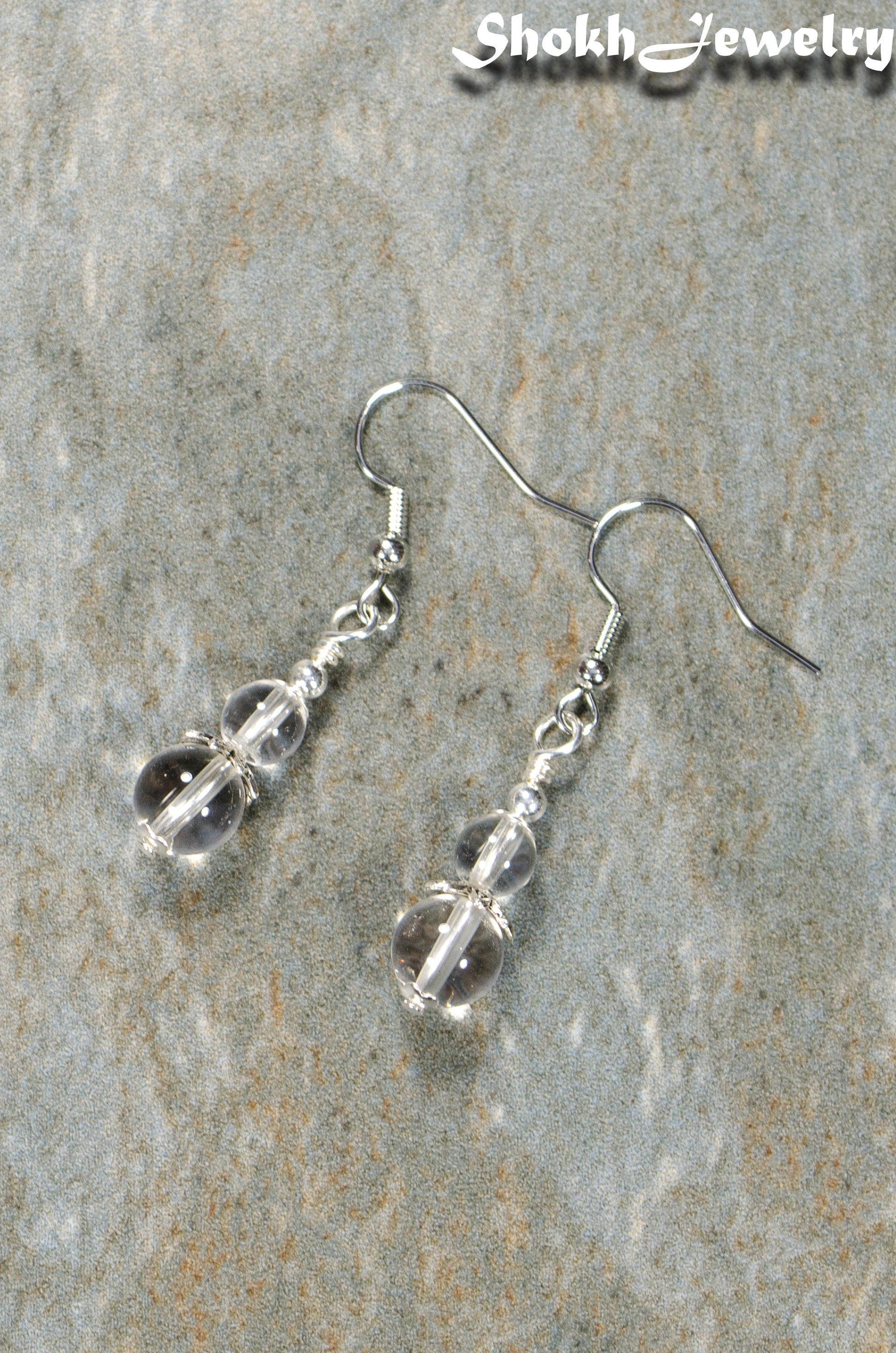 Top view of Small Clear Quartz Earrings.