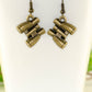 Close up of Antique Bronze Binocular Charm Earrings.