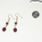 Dark Red and Gold Glass Bead Earrings beside a dime.