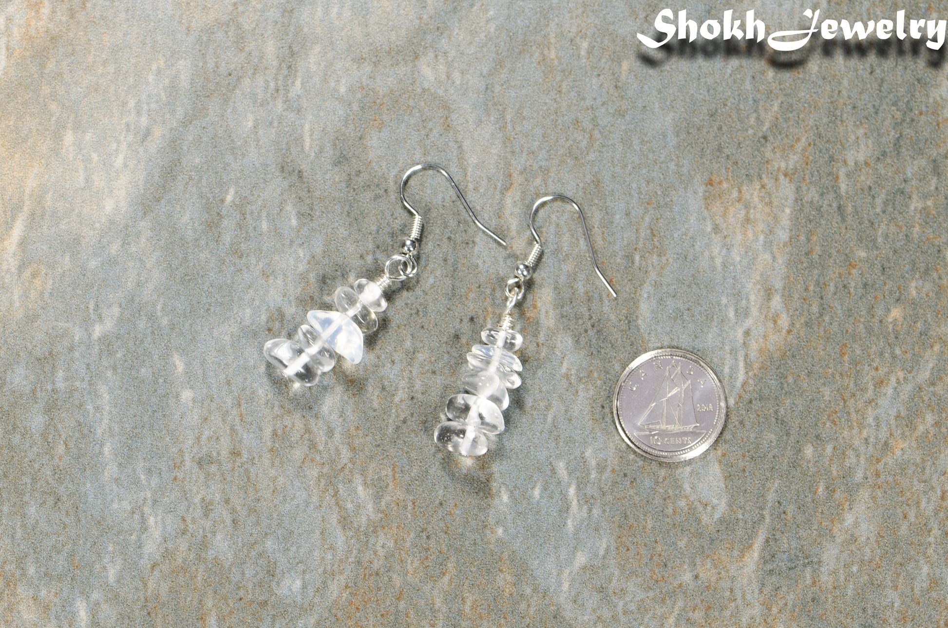 Simple White Opal Crystal Chip Earrings beside a dime.