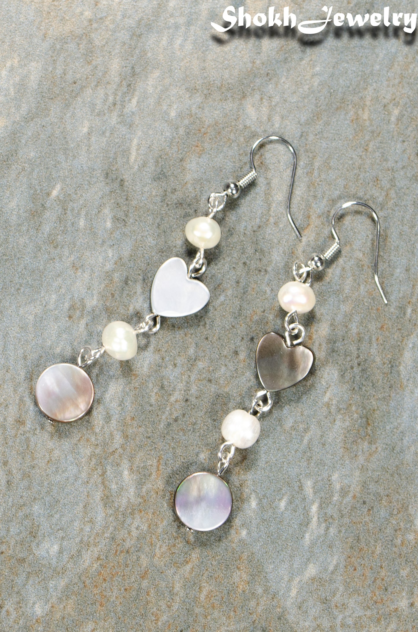 Top view of Long Grey Seashell and Freshwater Pearl Earrings.