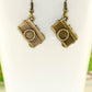 Close up of Antique Bronze Camera Charm Earrings.