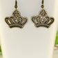 Close up of Antique Bronze Crown Charm Earrings.
