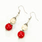 Top view of Red and White Howlite Dangle Earrings.