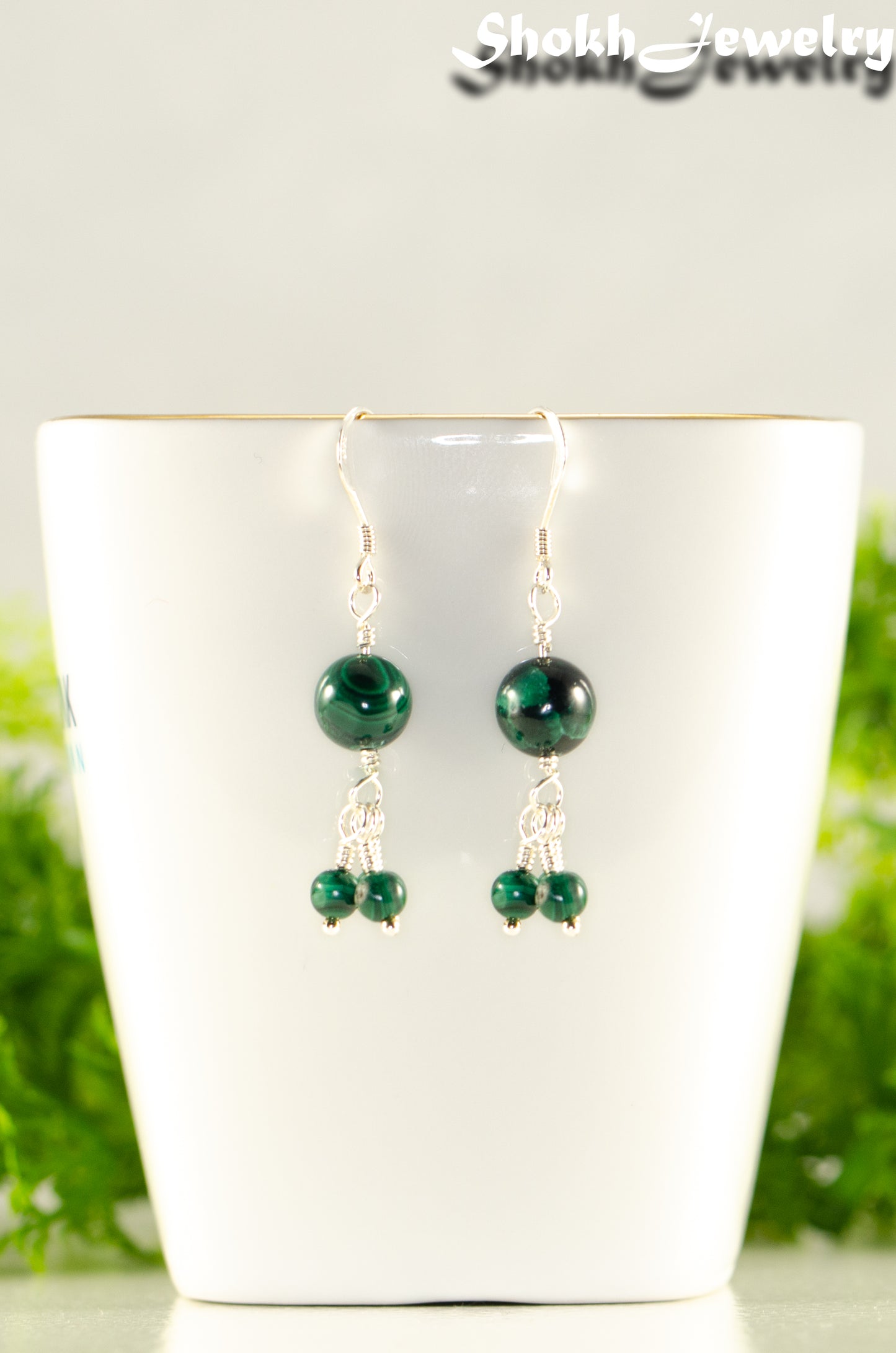 Close up of Genuine Malachite Dangle Earrings.