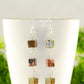 Close up of Long Unakite Cube Dangle Earrings.