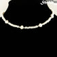 Freshwater Pearl and White Seed Bead Choker Necklace with Gold Plated Spacers displayed on a bust.