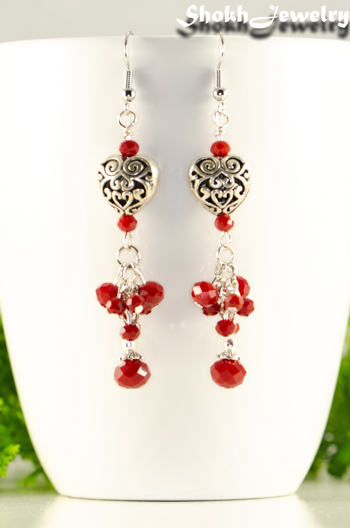 Close up of Tibetan Silver Heart and Red Beaded Cluster Earrings.