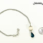 Lava Rock and Teardrop December Birthstone Choker Necklace beside a dime.