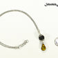 Lava Rock and Teardrop November Birthstone Choker Necklace beside a dime.