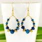 Close up of Blue and Gold Glass Crystal Hoop Earrings.